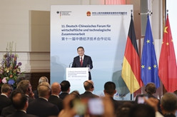 李强同德国总理共同出席第十一届中德经济技术合作论坛和中德企业家圆桌会