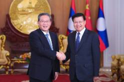 李强会见老挝人民革命党中央总书记、国家主席