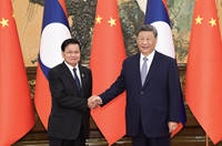 习近平会见老挝人民革命党中央总书记、国家主席