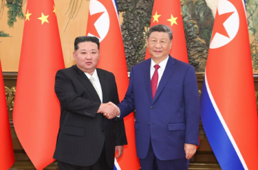 习近平同朝鲜劳动党总书记、国务委员长举行会谈