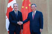 李强会见加拿大总理