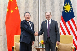 李强会见马来西亚总理