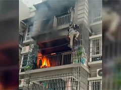 广州：居民楼起火 居委会工作人员爬楼扑救