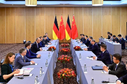 李强会见德国总理