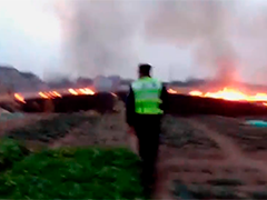 野外烧荒引发火情"惹火上身"被行政处罚