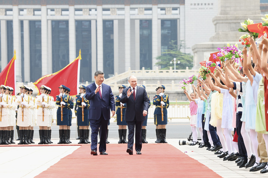 习近平举行仪式欢迎俄罗斯总统访华